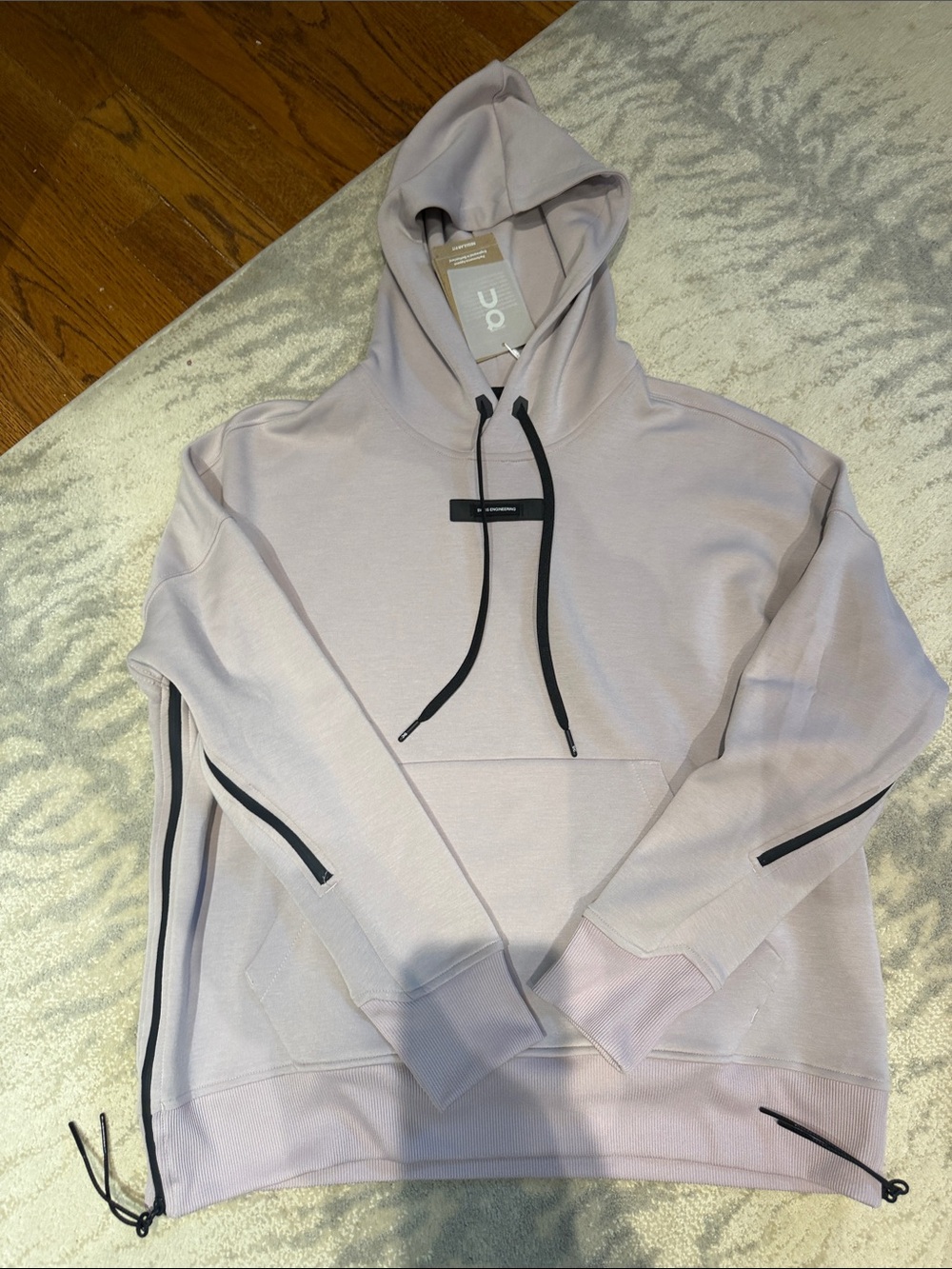 On Running women’s Light Pink Hooded Pullover with Black Accents